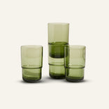 green tall drinking glasses stacked