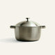 A large, stainless steel Titanium Perfect Pot Pro 7 qt. stockpot with two side handles and a matching lid with a knob handle.
