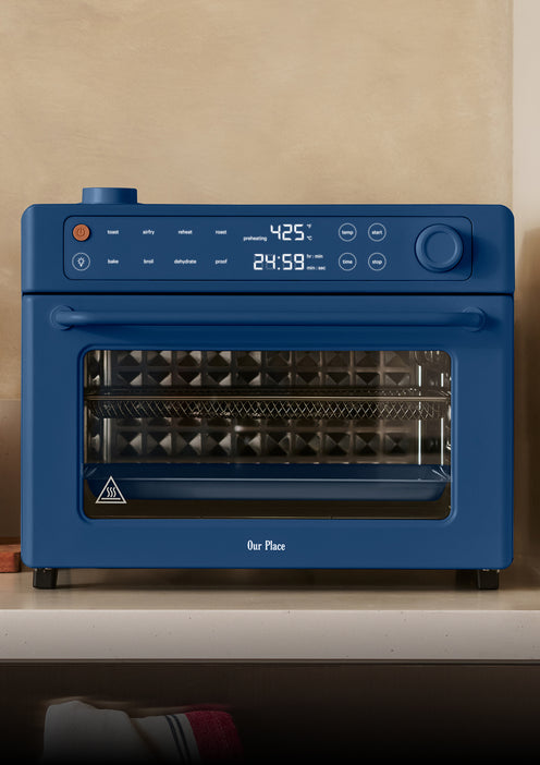 blue toaster oven on counter with digital display