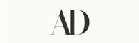 Black capital letters A and D in a modern serif font are centered on a plain, light background.
